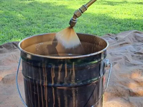 20230615_093302 Testing the spray pattern of the sprayer before using it on the fence.