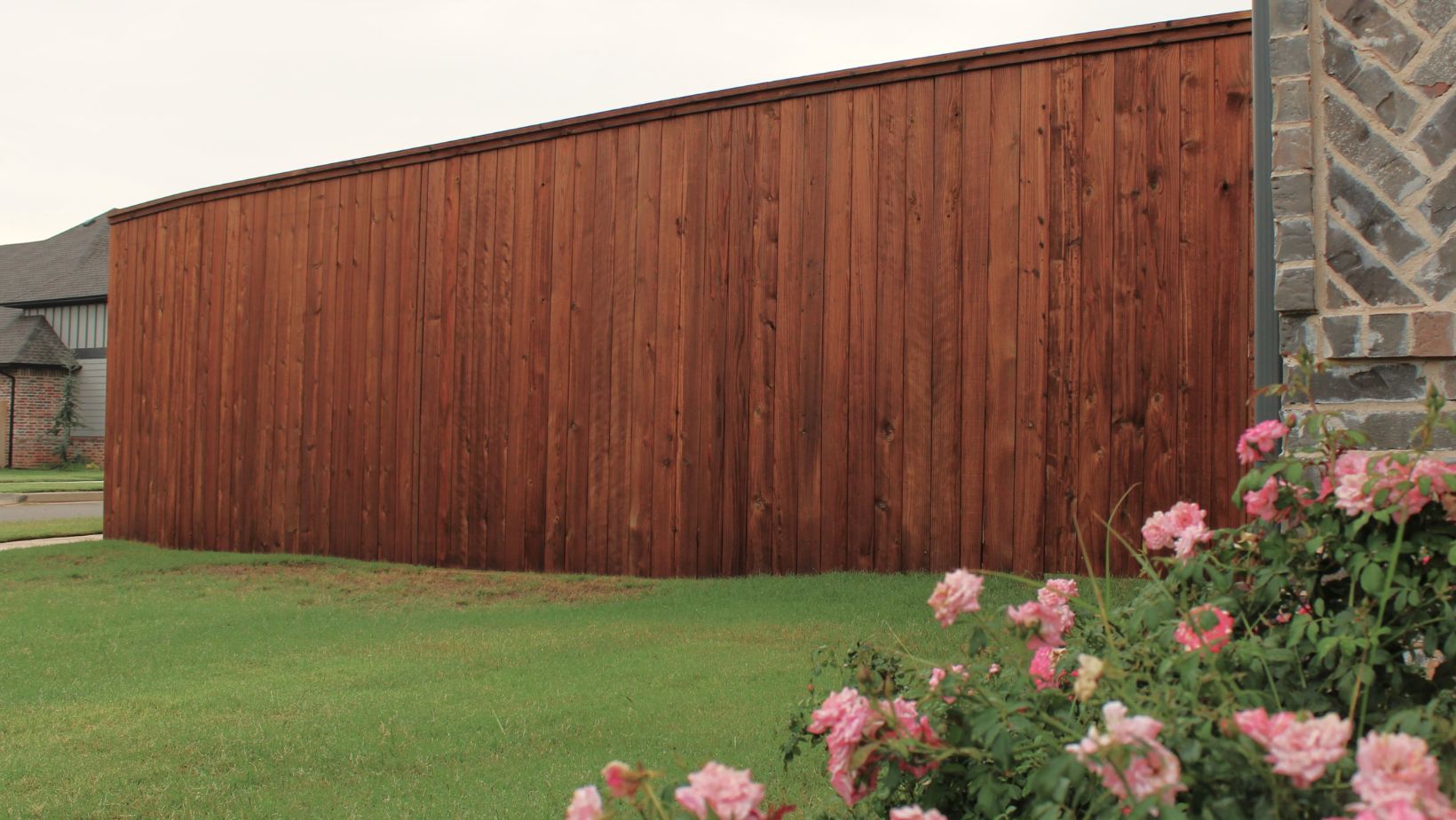 Cedar Fence Stain a fence that has just been stained beautifully showing how important it is to learn how to stain a fence.