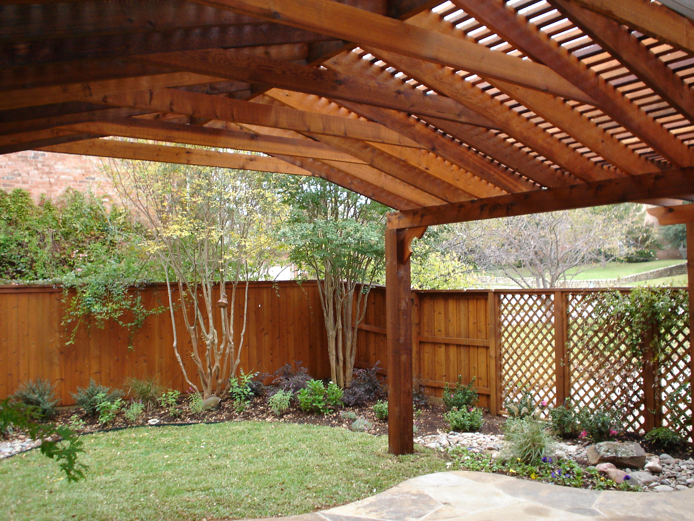 Copy of Pecan on cedar fence a traditional looking backyard with a warm brown fence stain