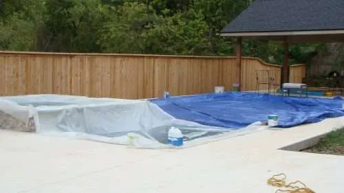 DSC05392 a fence around a pool that is ready for stain.