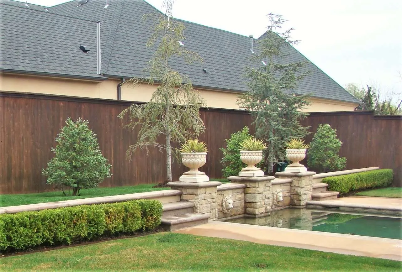 Fence Stain Nichols Hills 2 a nice backyard with a pool and a fence with the dark walnut fence stain color