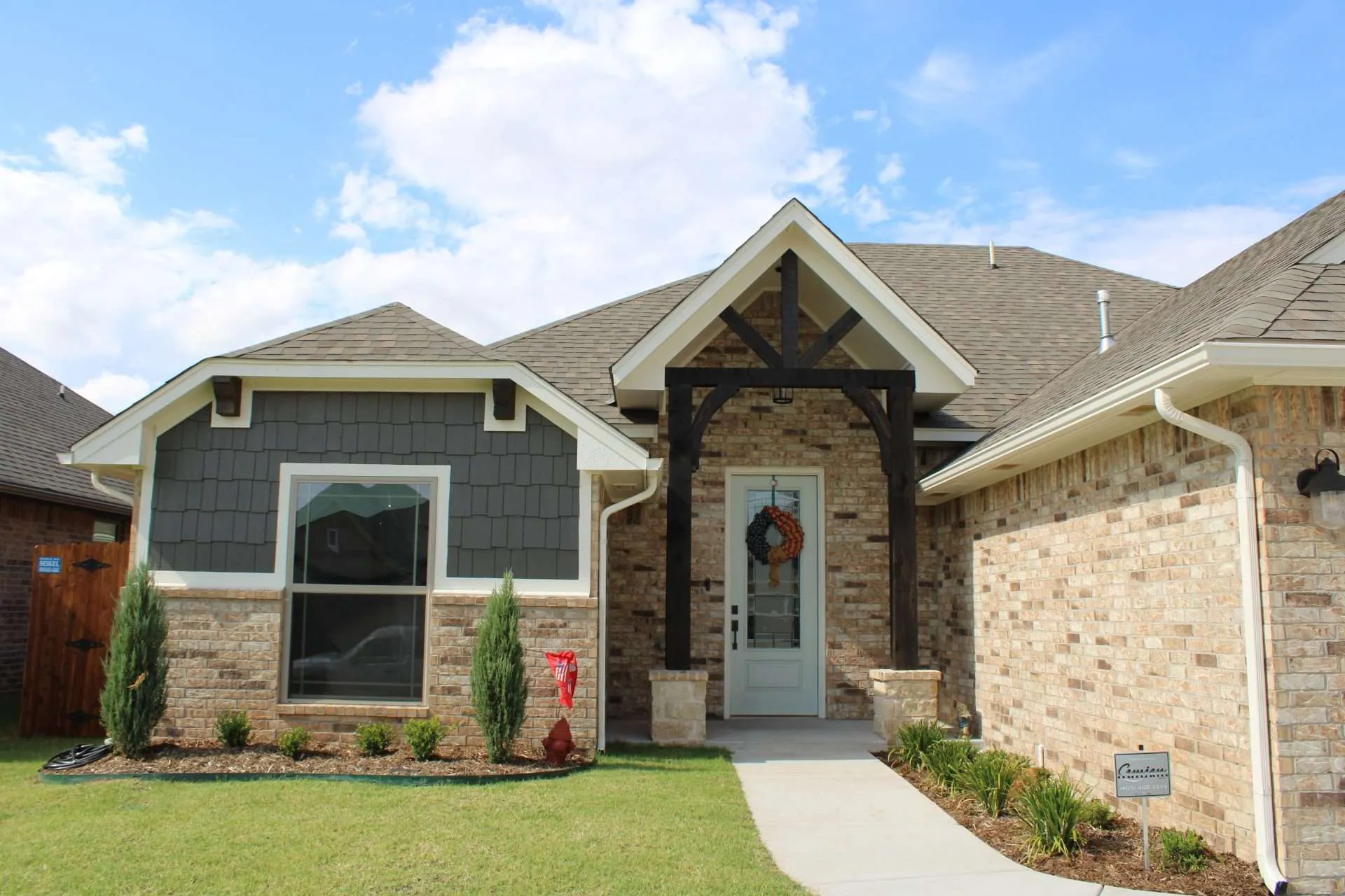 IMG_0171 the front of a house with dark brown stained accents