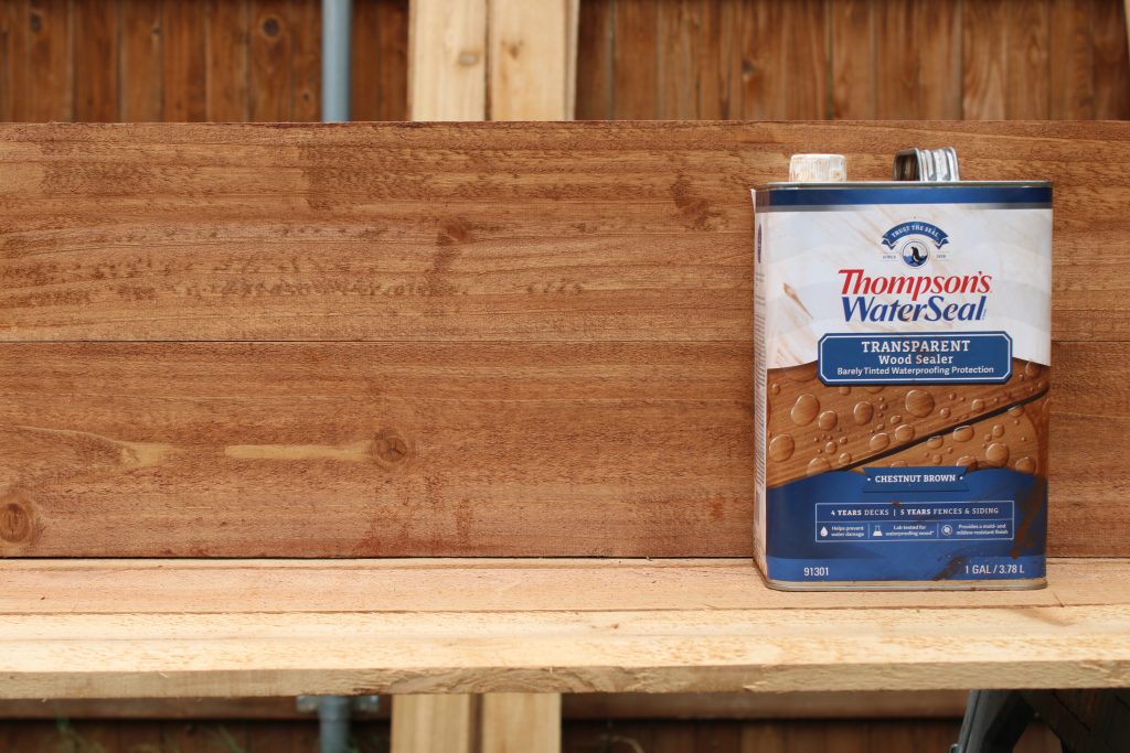 IMG_0742 two fence pickets with Thompson's water seal stain on them.