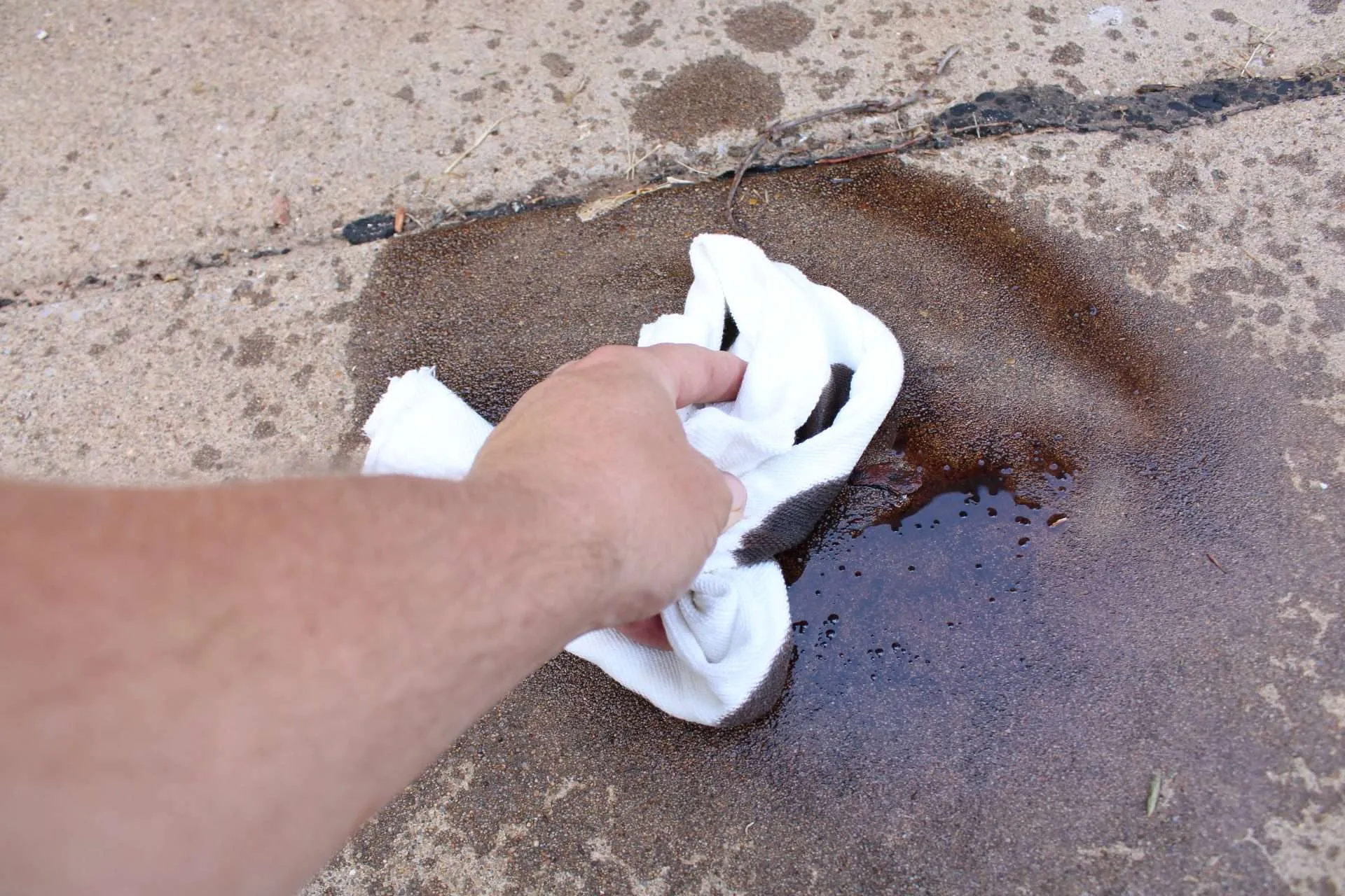 IMG_1620 a hand is using a clean rag to wipe up the extra stain.