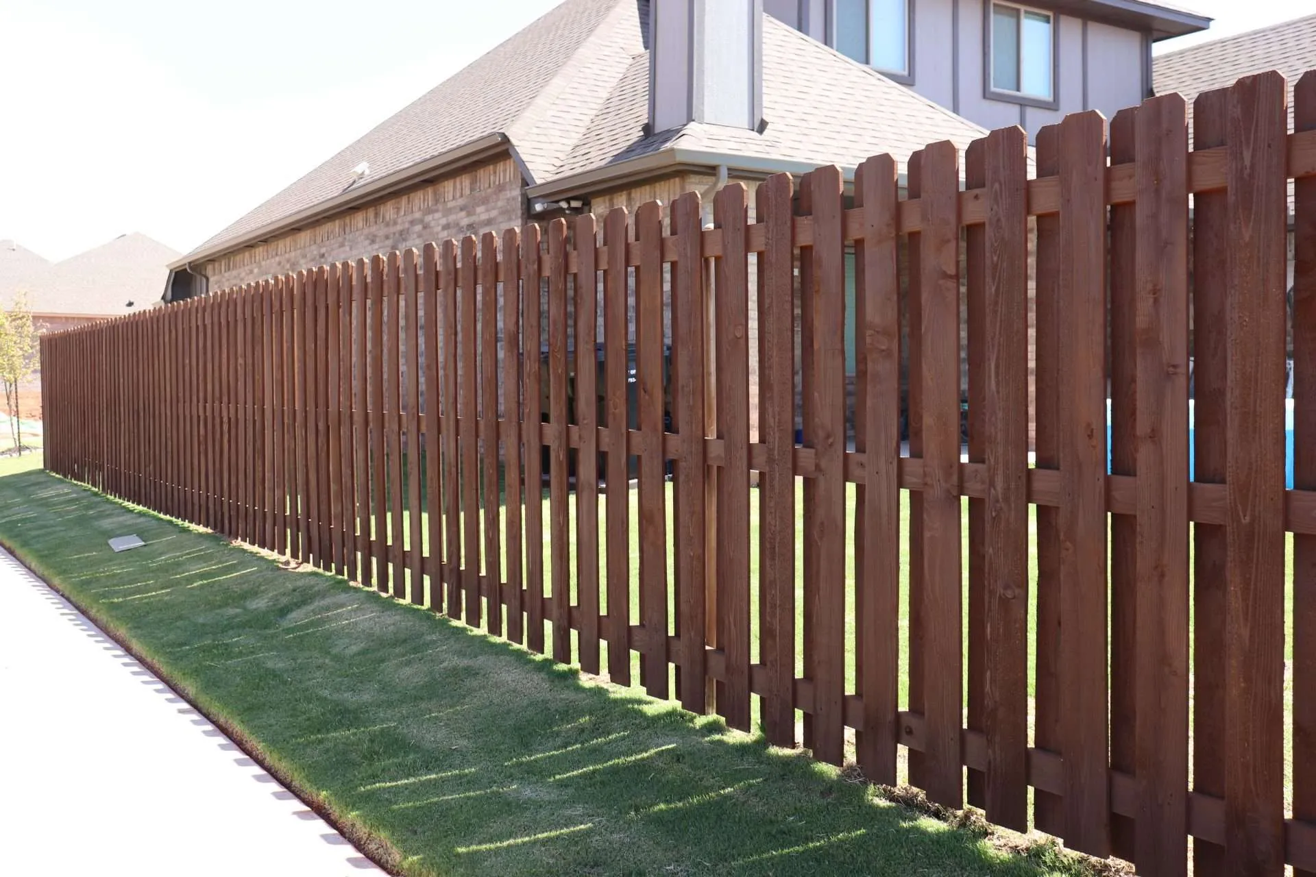 IMG_5380 a shadowbox fence with coffee colored fence stain.