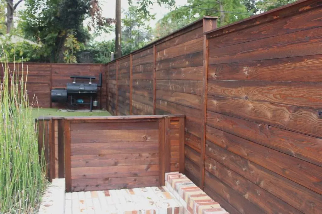 Modern Oxford Brown a modern backyard with a fence stained with oxford brown.