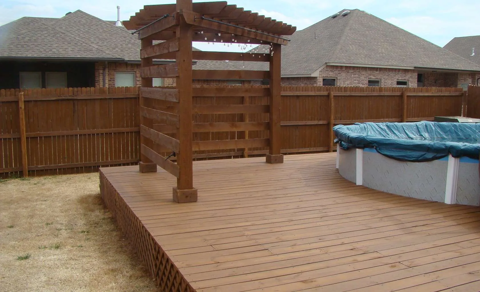 Sable Brown Deck sable brown fence stain on a deck, pergola and fence.