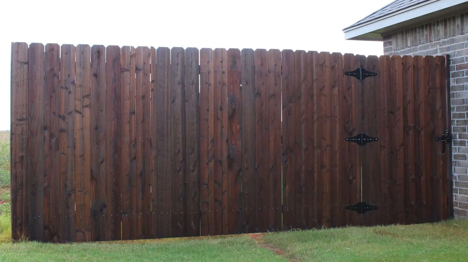 Dark Walnut Ready Seal Dark Walnut stain on a cedar fence
