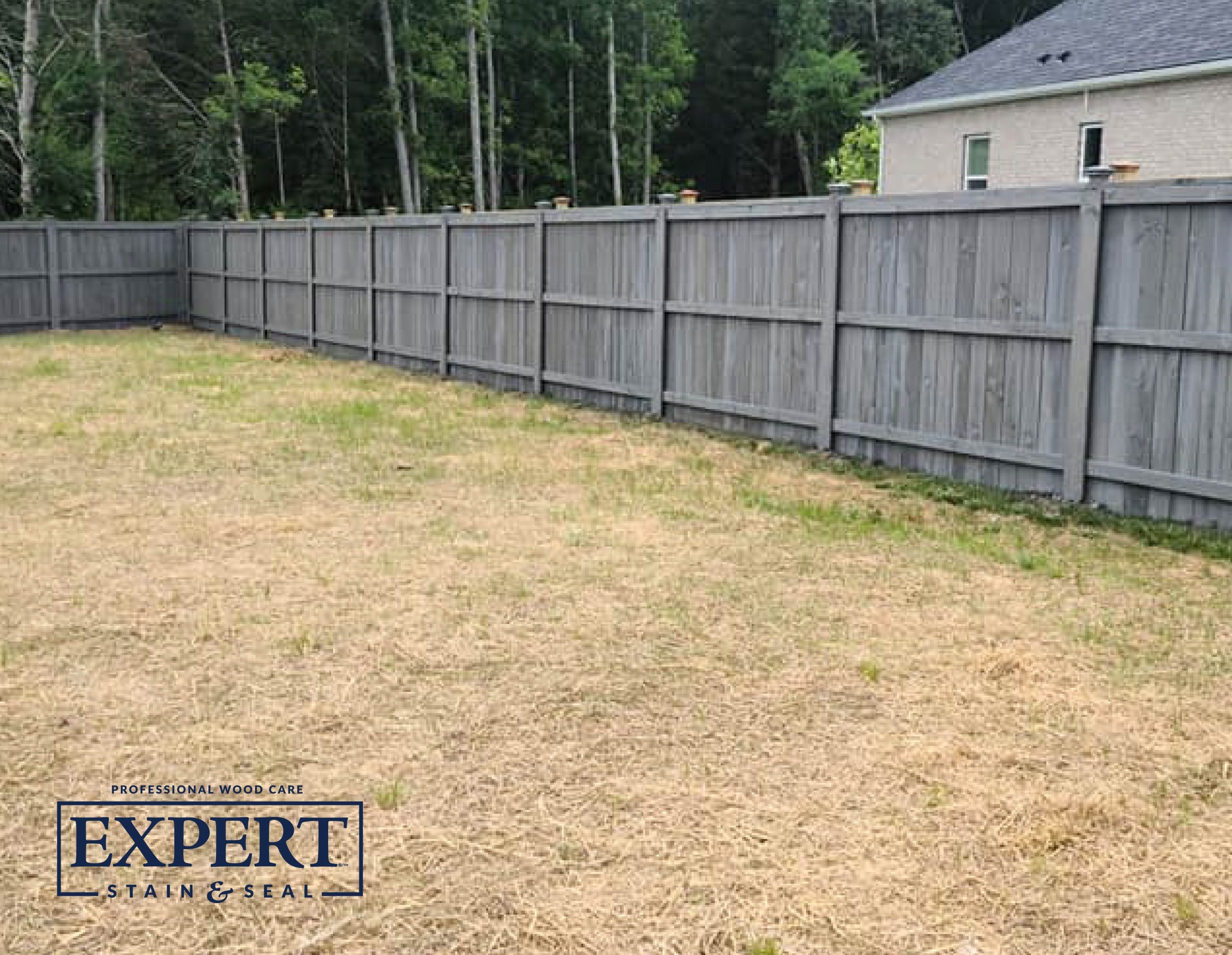 photos with expert logo a modern style fence with slate gray fence stain color on it.